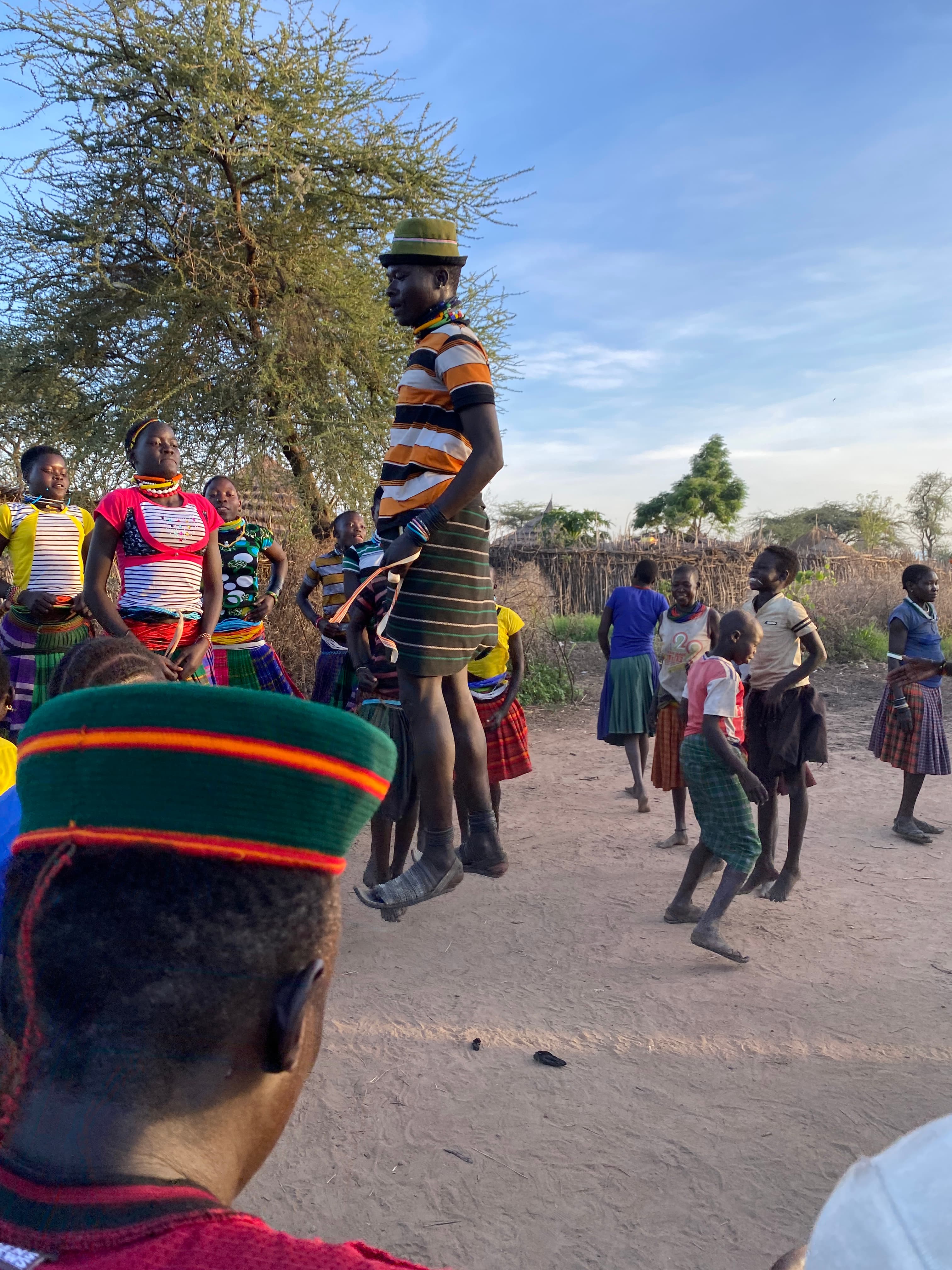 A Karamojong man leaping high in a traditional cultural dance in Nadunget, Moroto Uganda